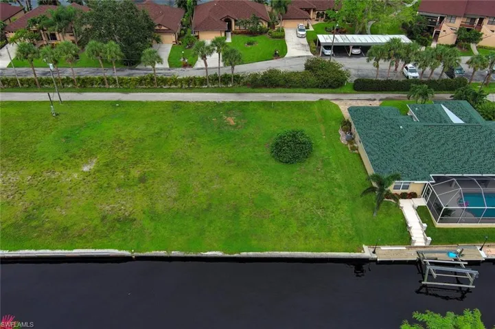 Drone / aerial view featuring a water view and a residential view