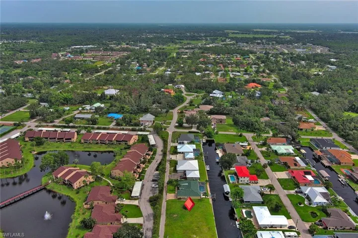 Bird's eye view with a water view and a residential view