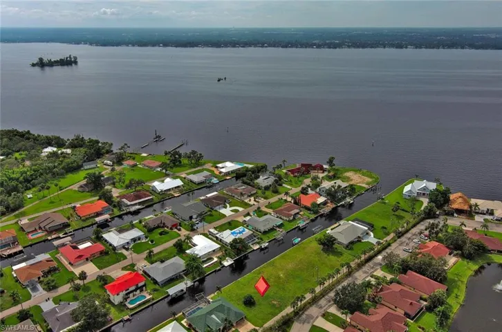 Aerial view featuring a residential view and a water view