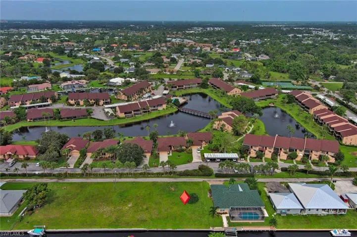 Drone / aerial view featuring a water view and a residential view