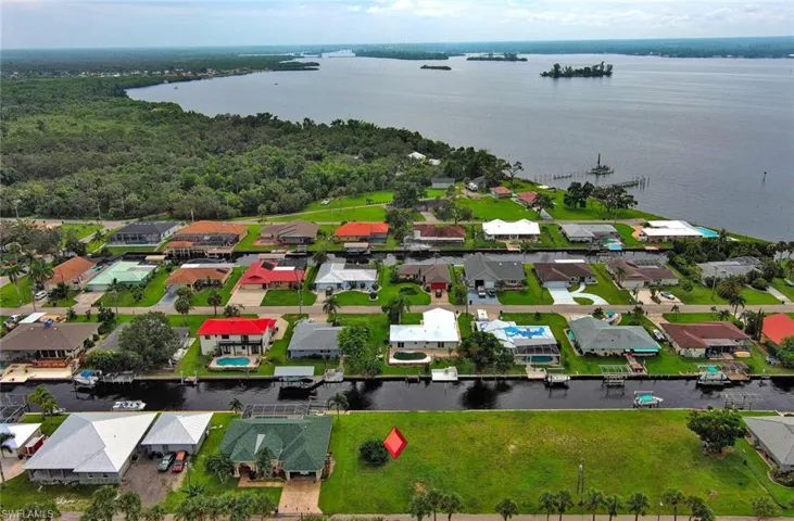 Drone / aerial view with a water view and a residential view