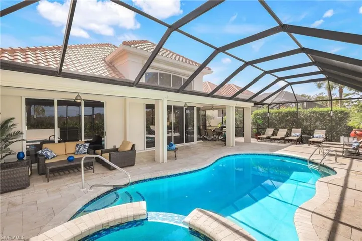 View of pool featuring an outdoor living space, a lanai, a patio area, and ceiling fan