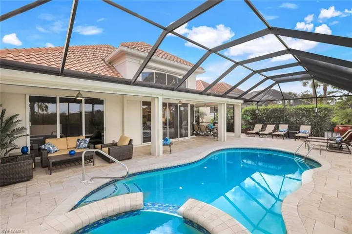 View of pool with a patio area, a lanai, an outdoor hangout area, and ceiling fan