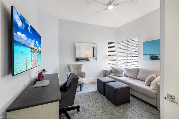 Office featuring a wealth of natural light, wood-type flooring, and ceiling fan