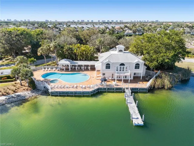 Drone / aerial view of city skyline and a nearby body of water