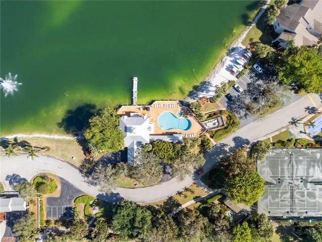 View of property location with a large body of water and a pool