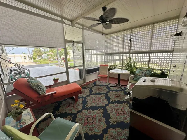 Breezeway living area with blinds all around.