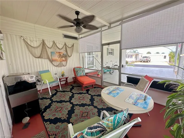 Enjoy balmy breezes in your outdoor living space with blinds to shade the front western exposure.