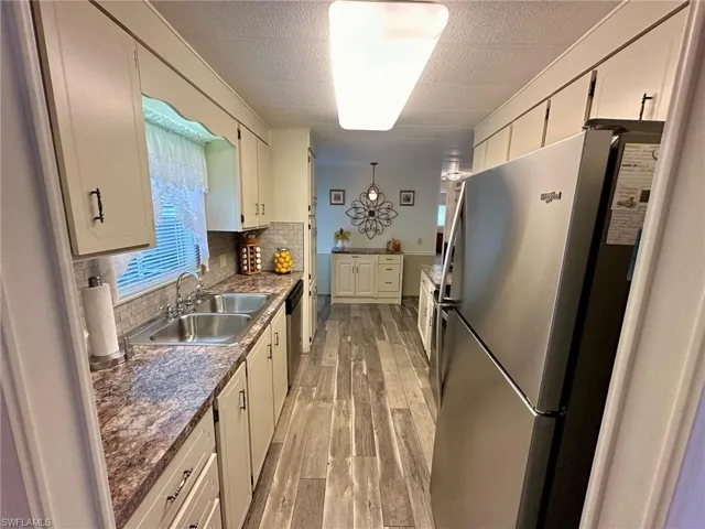 Updated kitchen with stainless steel sink and appliances