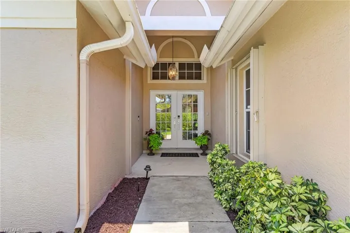 Doorway to property featuring french doors