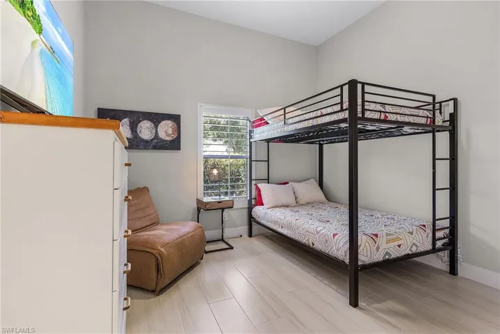 Bedroom with wood-type flooring