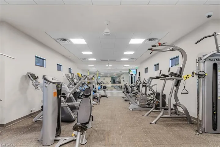 Workout area featuring a drop ceiling