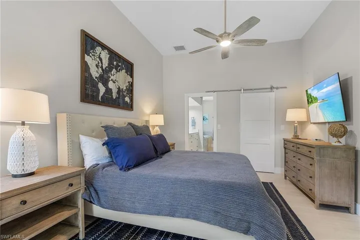 Bedroom featuring ceiling fan and light hardwood / wood-style flooring