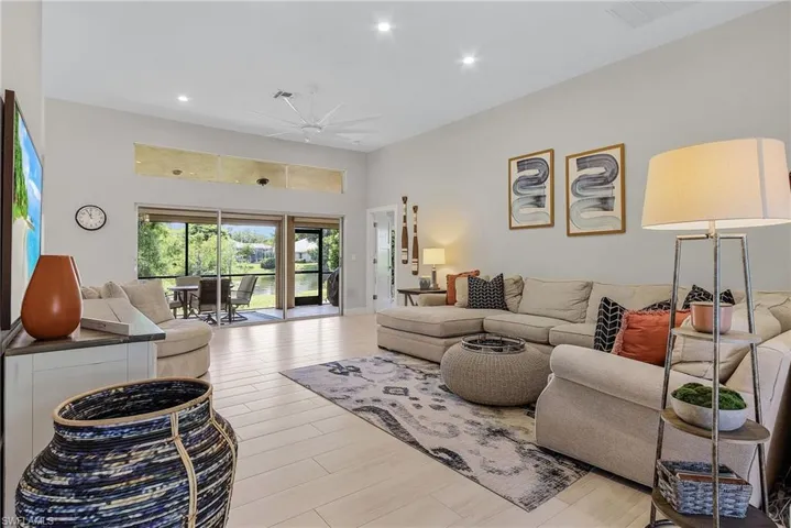 Living room with hardwood / wood-style flooring and ceiling fan