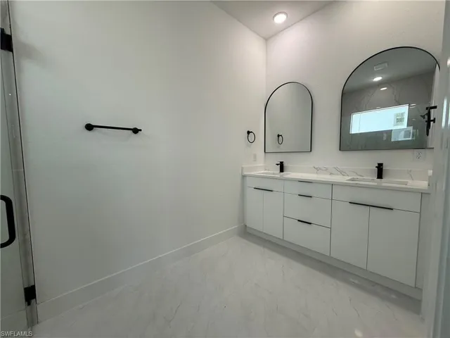 Garage with a textured wall and water heater