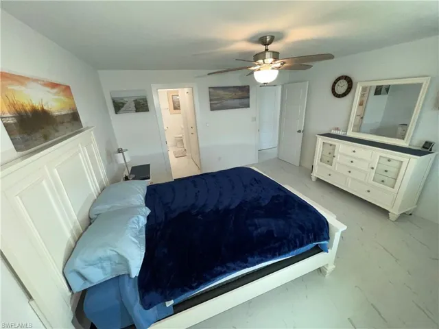 Bedroom with connected bathroom and ceiling fan