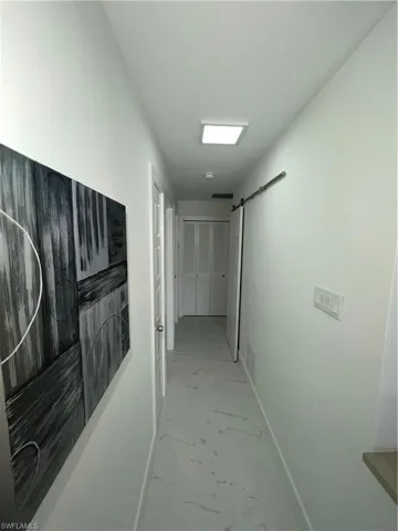 Hall featuring a barn door
