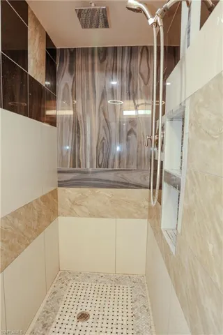 Bathroom featuring tiled shower