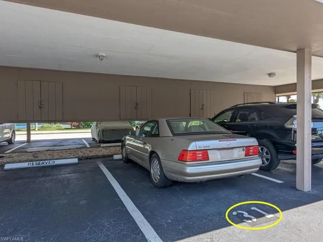 View of vehicle parking with a carport