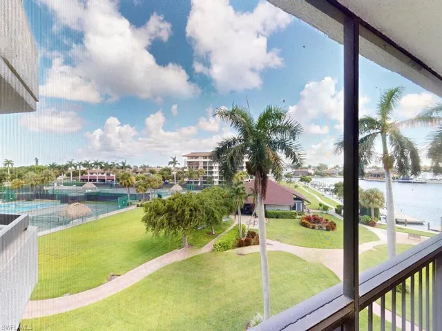 View of home's community featuring a lawn and a water view