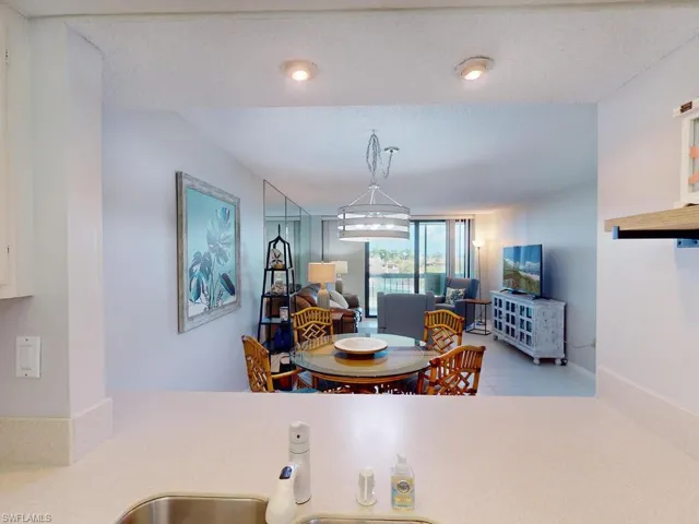 Tiled dining space with a textured ceiling