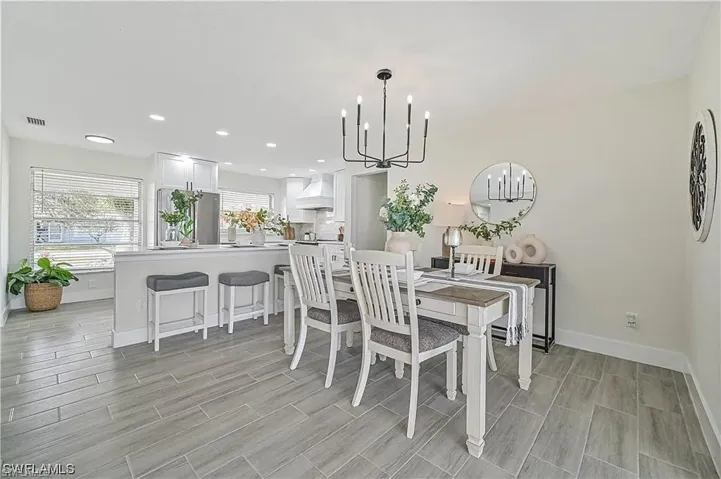 The interior features light-colored walls and grey rectangular tile flooring