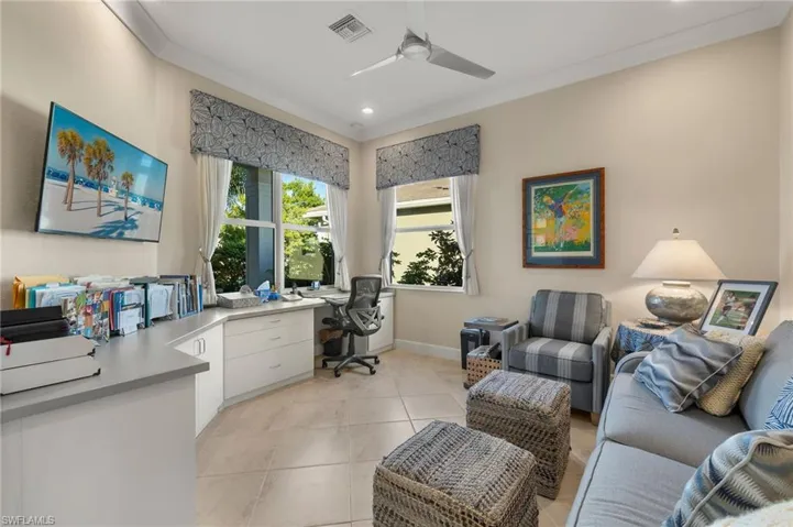 Located at front of home with 3 windows, this den features a built-in desk with lots of storage!!!