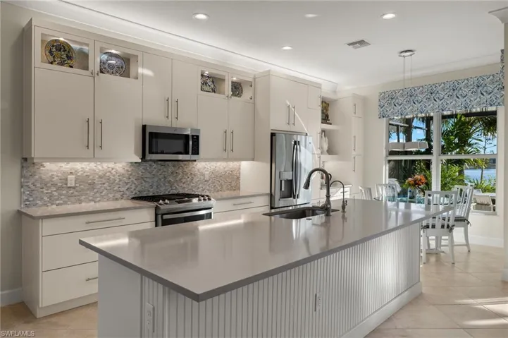 Island Bar will seat 4. NOTE the upper cabinets with clear glass, the extended cabinets to breakfast nook and the 6 WIDE drawers that you will LOVE, LOVE, LOVE!