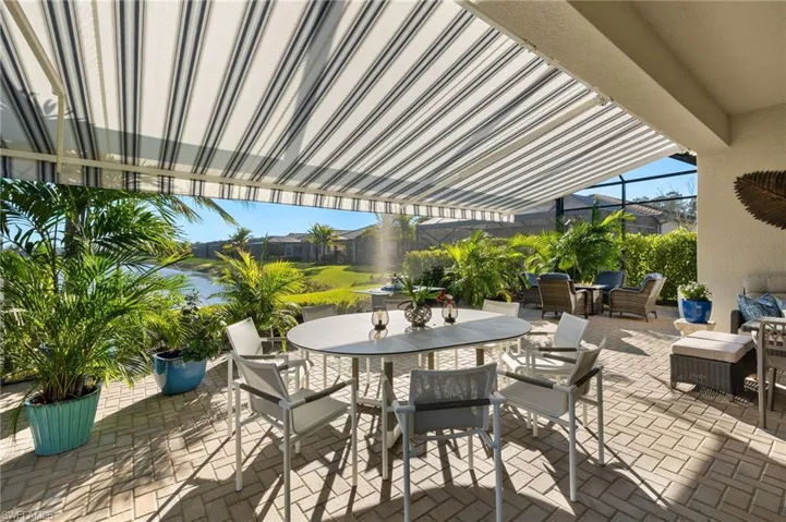 WOW!!! Retractable awning puts portion of this approx. 800 sq ft outdoor living space in the shade...