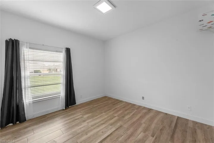 Spare room featuring light hardwood / wood-style floors