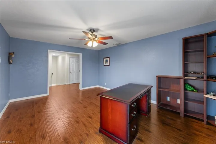 Master bedroom Carpeted empty room featuring ceiling fan