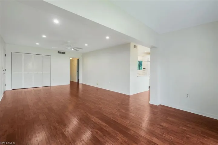 Unfurnished living room with recessed lighting, hardwood / wood-style floors, and ceiling fan