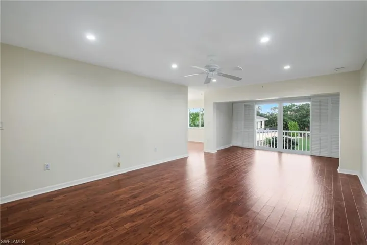 Unfurnished room with recessed lighting, dark wood finished floors, and ceiling fan