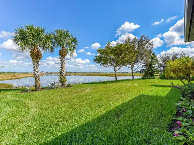 View of yard with a water view