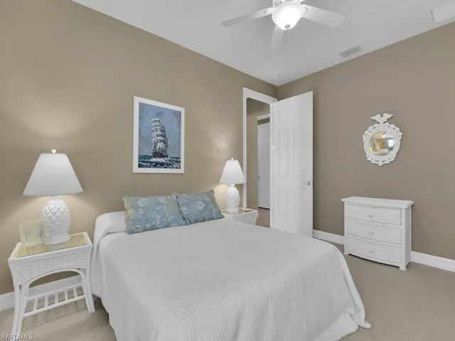 Bedroom featuring ceiling fan and light colored carpet