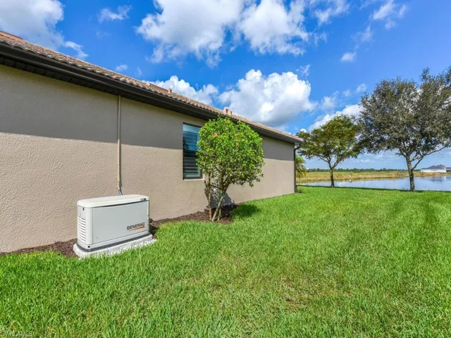 View of yard with a water view
