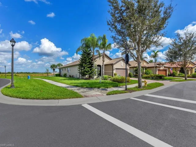 View of front of house featuring a front yard and a garage