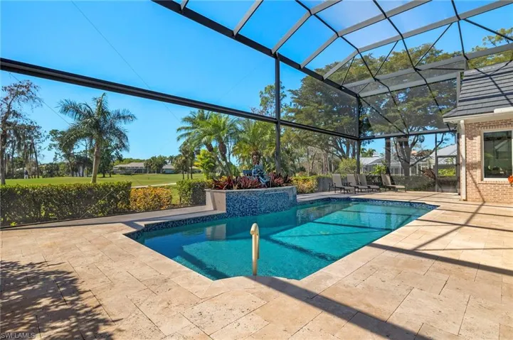 Outdoor pool featuring a patio and a lanai