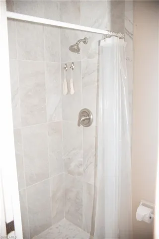 Bathroom featuring a shower with curtain