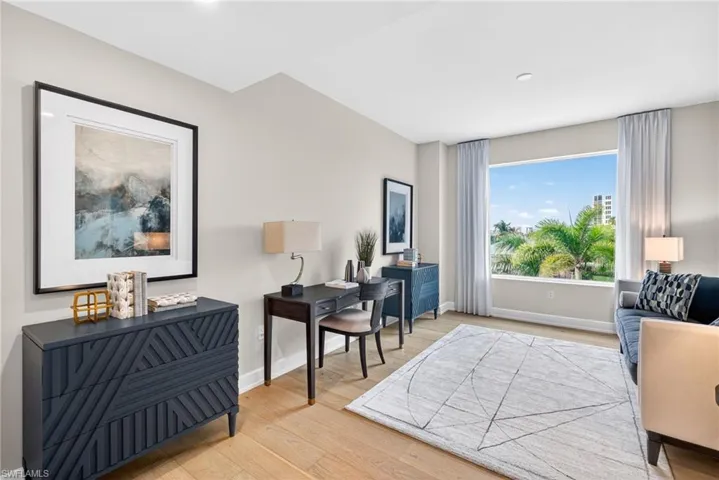 Spacious Den/flex space featuring large window making for a bright airy space to enjoy