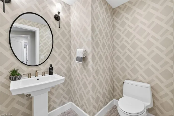 Guest powder bathroom simple coastal decor with contemporary wall paper design