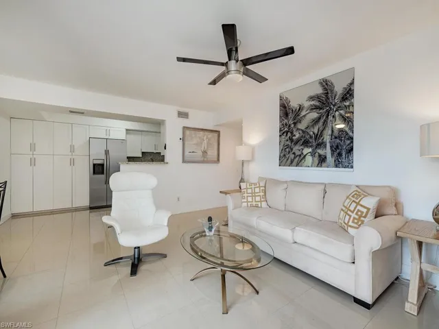 Living room featuring ceiling fan