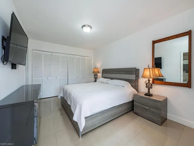 Bedroom featuring baseboards and a closet