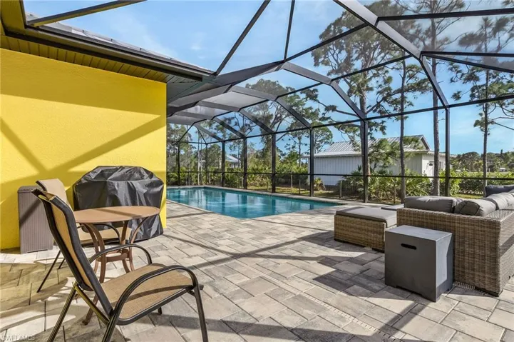 View of pool featuring outdoor lounge area, a lanai, and a patio area