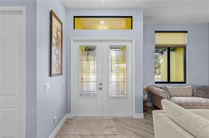 Entryway featuring light hardwood / wood-style flooring and french doors