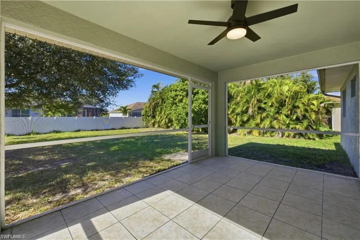 Unfurnished sunroom with a ceiling fan