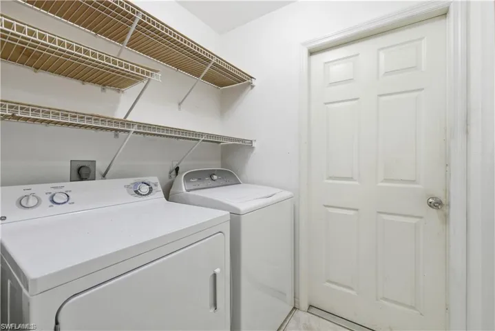 Laundry room featuring independent washer and dryer