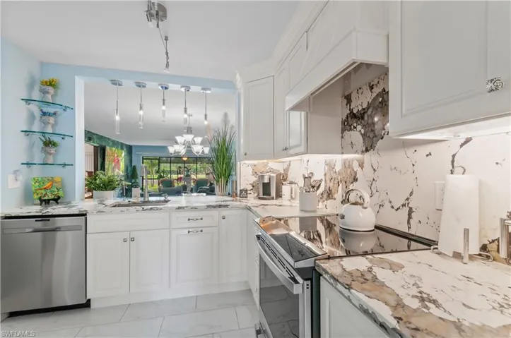 Modern kitchen featuring light cabinetry, stainless steel appliances, and Quartz countertops