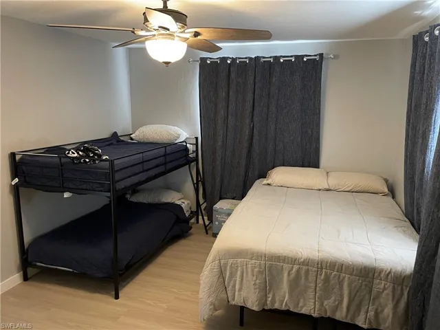 Bedroom with light wood-style flooring and ceiling fan