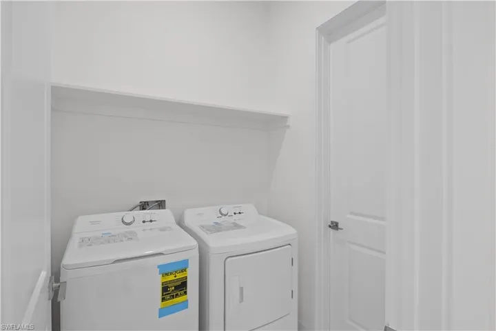 Washroom with washing machine and dryer
